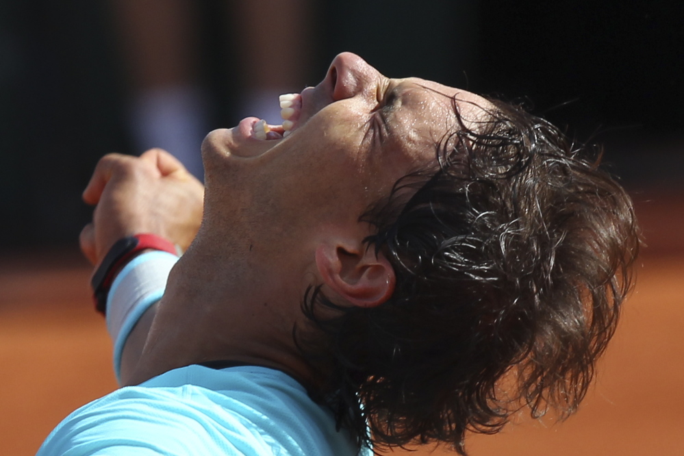 The Associated Press Spain’s Rafael Nadal celebrates winning the semifinal match of the French Open tennis tournament against Britain’s Andy Murray at the Roland Garros stadium, in Paris, France, on Friday.