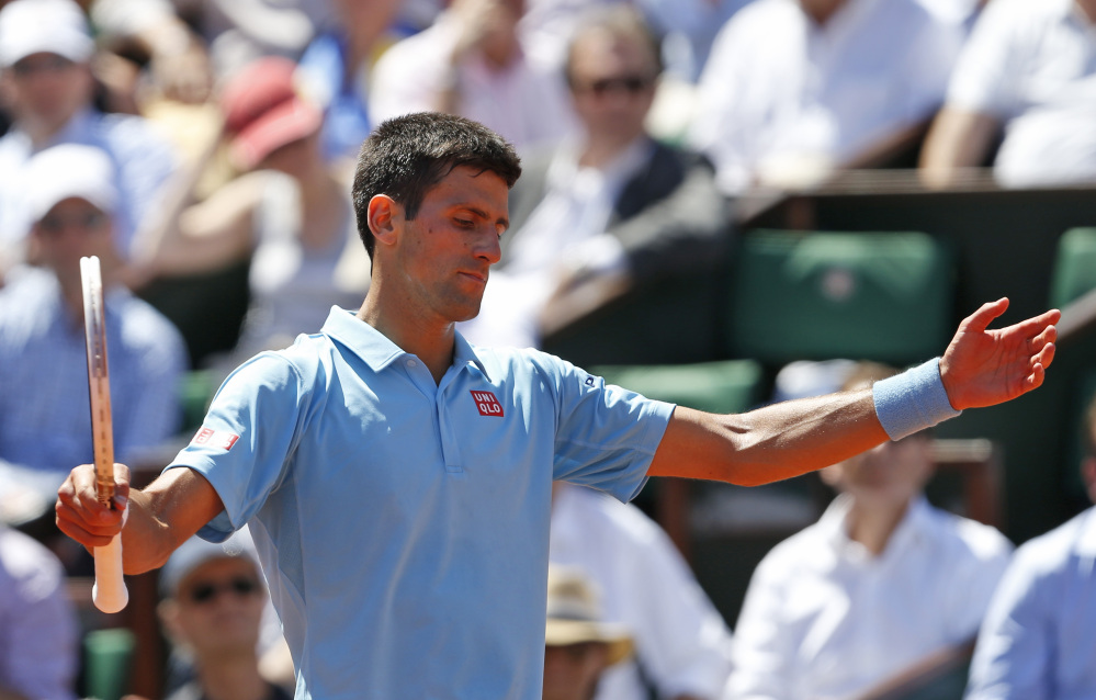 The Associated Press Serbia’s Novak Djokovic gestures during the semifinal match of the French Open tennis tournament against Latvia’s Ernests Gulbis at the Roland Garros stadium, in Paris, France, on Friday.