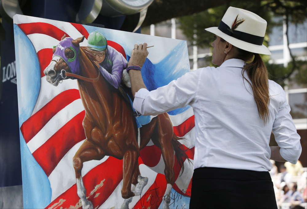 The Associated Press/Kathy Willens Artist Susan Sommer-Luarca, of Springfield, Mo., paints an image of Triple Crown hopeful California Chrome outside the grandstand at Belmont Park during the undercard races for the Belmont Stakes horse race, Saturday, June 7, 2014, in Elmont, N.Y.