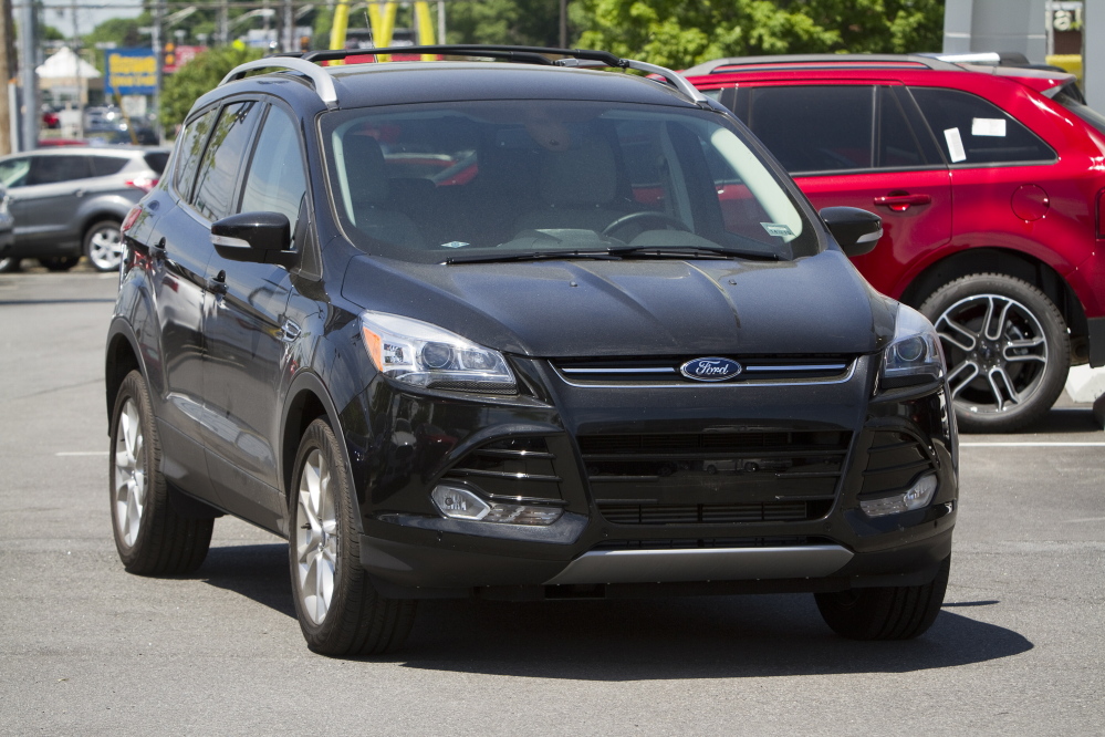 Carl D. Walsh/Staff Photographer This 2014 Ford Escape was among the vehicles stolen by a scam artist from local dealerships in late May, police say. The vehicle is back at Rowe Ford in Westbrook, from where it was stolen.