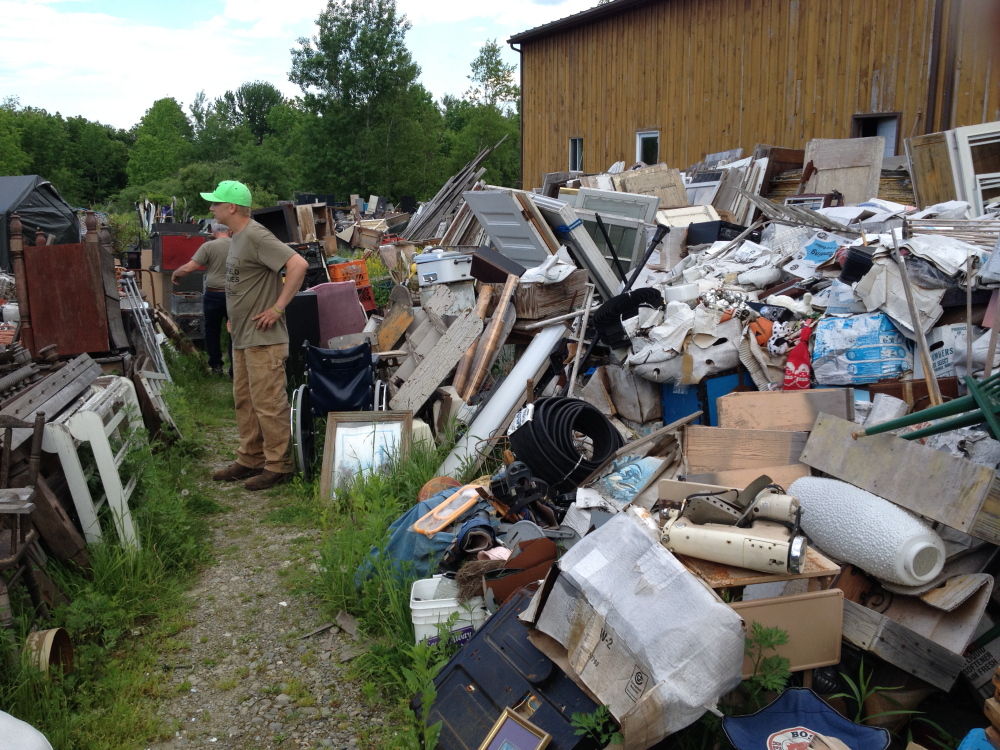 Staff Photo by Matt Hongoltz-Hetling STAND-OFF: Ralph McLaughlin, manager of the Fairfield Antique Mall on U.S. Route 201 in Fairfield, stands along a right of way the business has through the neighboring property of Maine 201 Antiques next door.