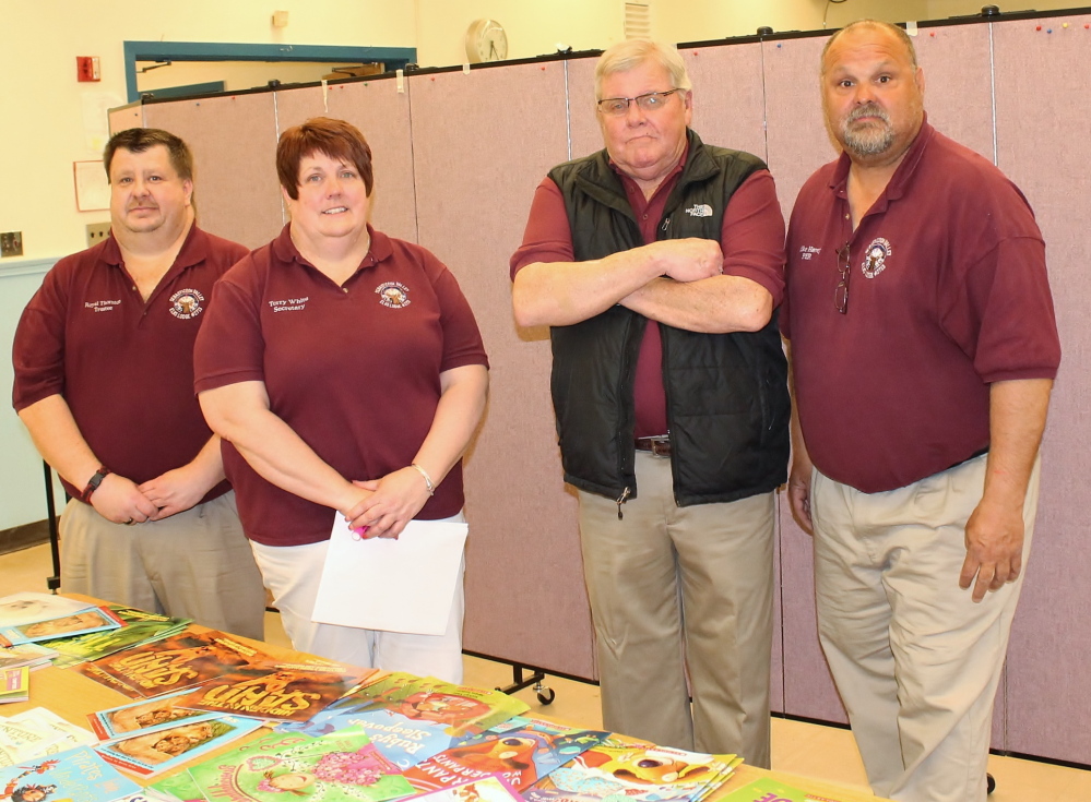Maine Elks Association photo Family Literacy is focus: From left are Trustee Royal Thornton, Secretary Terry White, Exalted Ruler (Lodge President) Dennis Bragg and State Trustee Michael Havey.