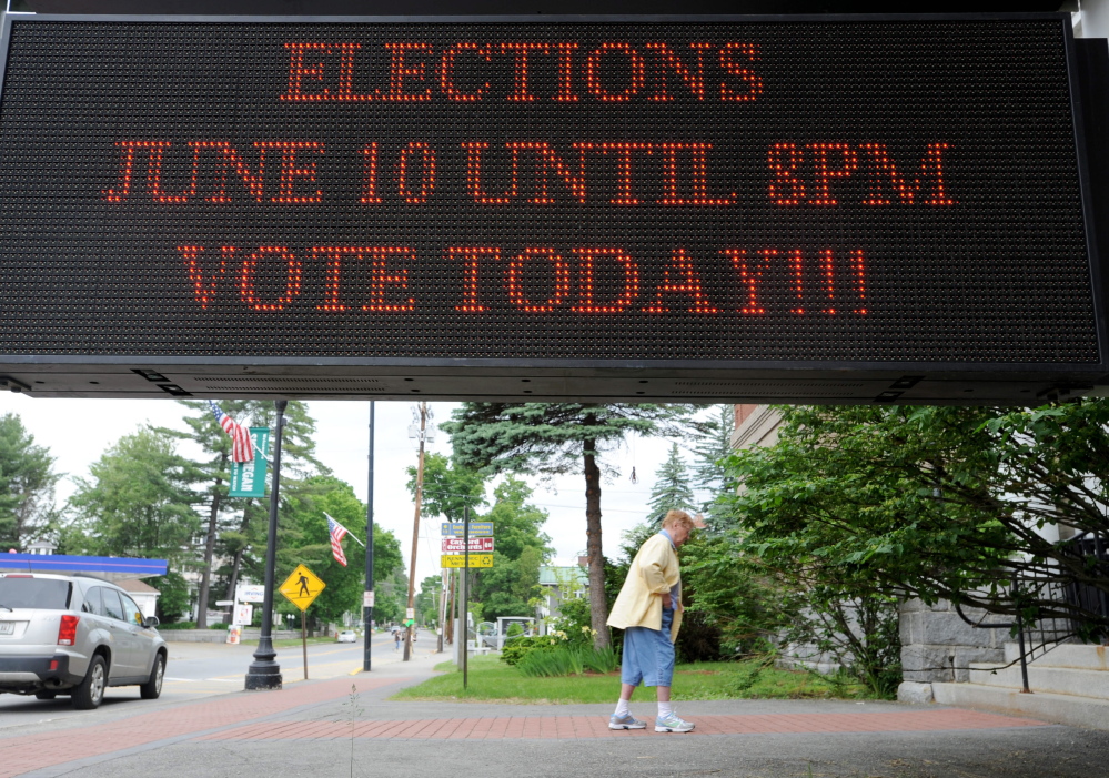 Staff photo by Michael G. Seamans 
 A voter walks in to the Skowhegan Town Office to vote in the primaries on Tuesday, June 9, 2014.