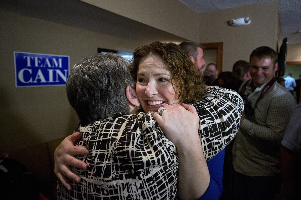 Victory: Democrat Emily Cain hugs a supporter at the Holiday Inn in Bangor after she defeated her opponent, Troy Jackson, in the primary election Tuesday.