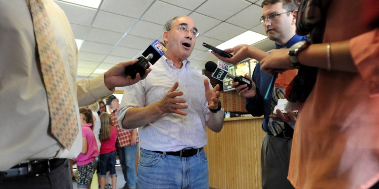 Campaign: Bruce Poliquin, Republican candidate for the 2nd Congressional District seat, speaks to reporters at the Oakland House of Pizza, in Oakland, on Wednesday, a day after he defeated Kevin Raye in the primary election.