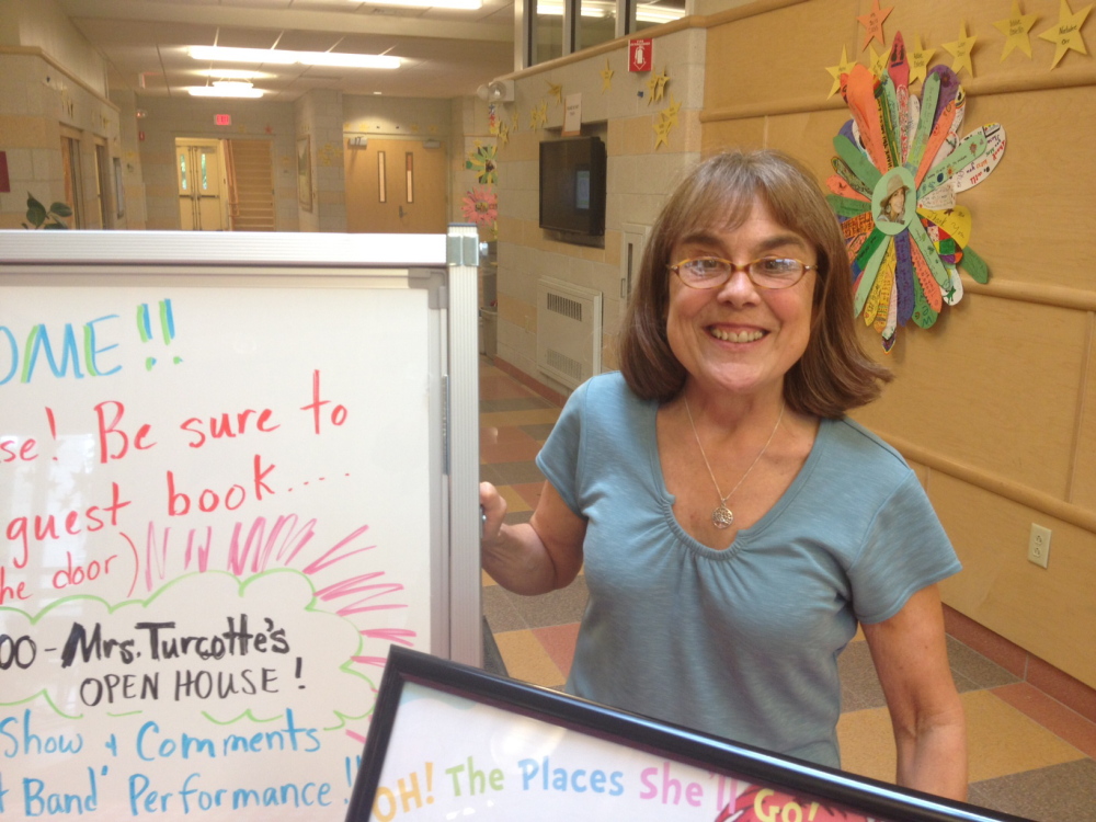 LIBRARIAN HONORED: Students, parents and teachers gathered at the Mallett School in Farmington Thursday to honor Betsy Turcotte, who is retiring as the school librarian after two decades encouraging thousands of students in kindergarten through third grade to develop an interest in books