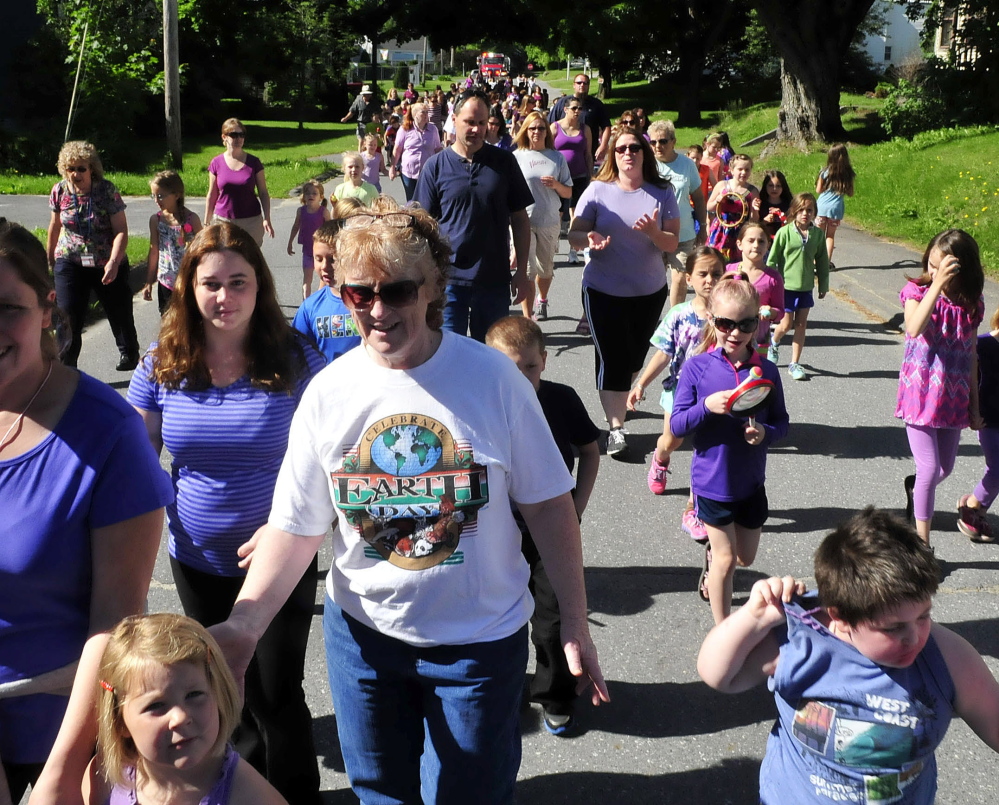 SUPPORT: More than 250 Atwood Primary School students, parents and staff marched through downtown Oakland to show support for students and siblings Adrianna and Blake Pettengill who are being treated for cystic fibrosis on Monday, June 16, 2014.