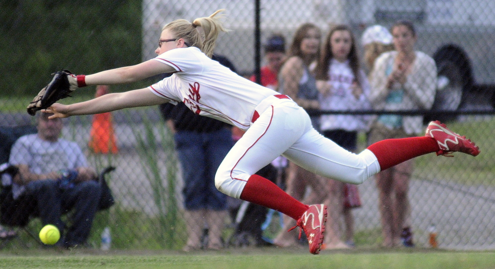 Cony High School’s Autumn Sudsbury can’t collect from Skowhegan High School during the Eastern A softball final Tuesday June 17, 2014 in Augusta.