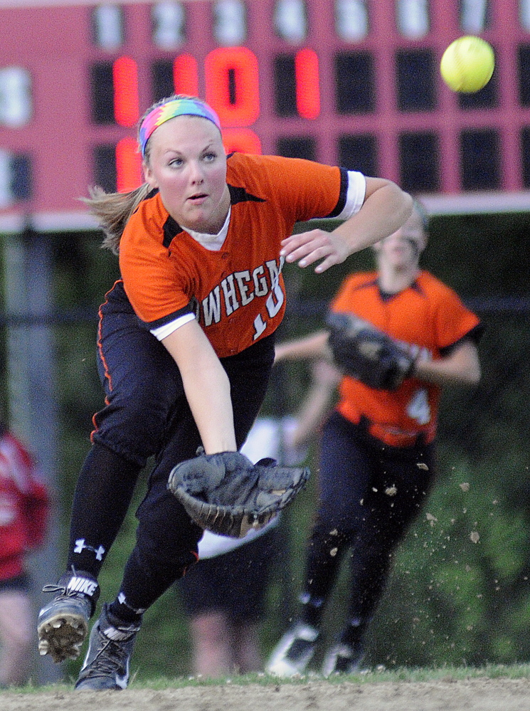 Skowhegan High School’s Eliza Bedard can’t collect a pop up from Cony High School during the Eastern A softball final Tuesday June 17, 2014 in Augusta.