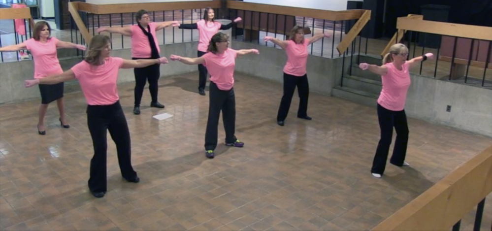 GOOD CAUSE: Dancers rehearse at University of Maine at Augusta for a pink glove dance routine that will be part of a cancer fundraiser video contest.