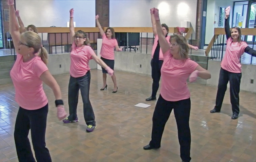 TICKLED PINK: Dancers rehearse at University of Maine at Augusta for a pink glove dance routine that will be part of a cancer fundraiser video contest.