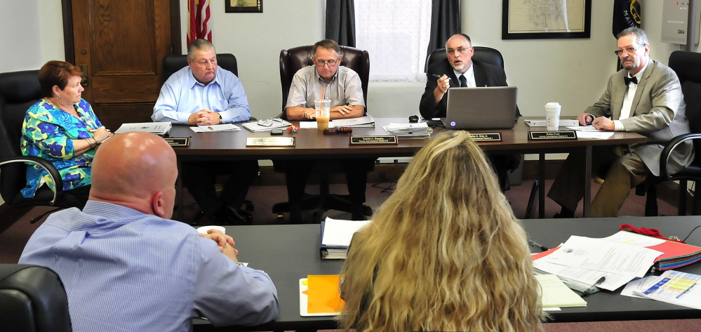 Staff photo by David Leaming 
 HEAR YE: The Somerset County Board of Commissioners held a budget workshop and meeting in Skowhegan on Wednesday, June 18, 2014. From left commissioners Lynda Quinn, Lloyd Trafton, Robert  Dunphy, Phillip Roy Jr. and Robin Frost deal with jail administration budget suggestions.