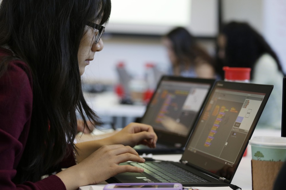 Annie Ly, 16, works on completing an exercise during a Girls Who Code class at Adobe Systems in San Jose, Calif. Girls Who Code, a national non-profit organization that aims to inspire, educate and equip young women for futures in the computing-related fields, kicked off its summer program in partnership with the world’s leading tech companies.