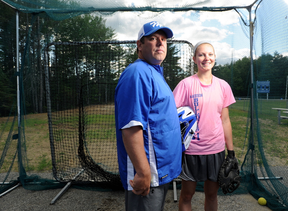 NO PROBLEM: Aly LeBlanc, right, has no problems with her dad Chris, left, coaching the Madison High School softball team. In fact, Aly is hitting .420 this season, with 28 RBIs.