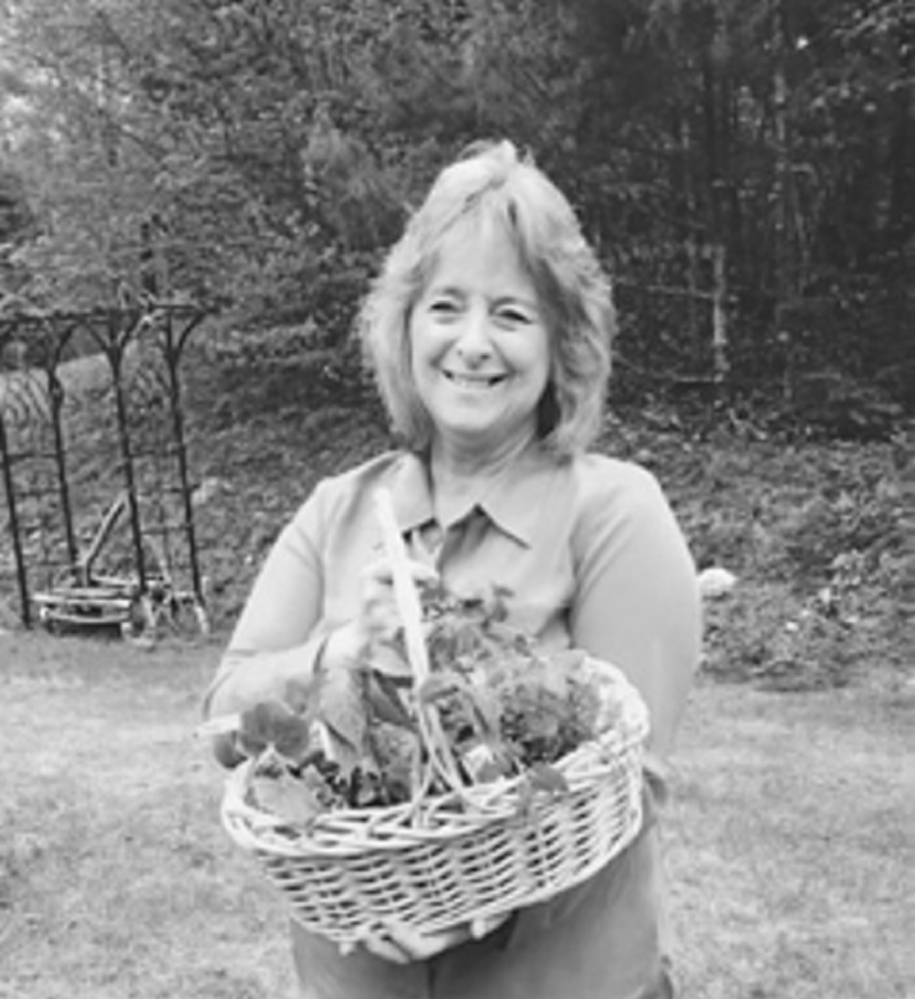 Linda Adkins holds the basket she won from the Monmouth Garden Club’s raffle.