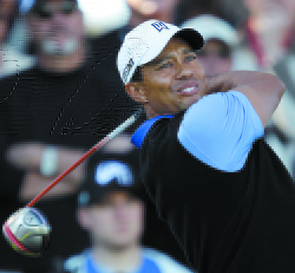 BACK AT IT: Tiger Woods, who has missed tournaments due to a back injury, will return next week at the Quicken Loan National. Woods had back surgery on March 31.