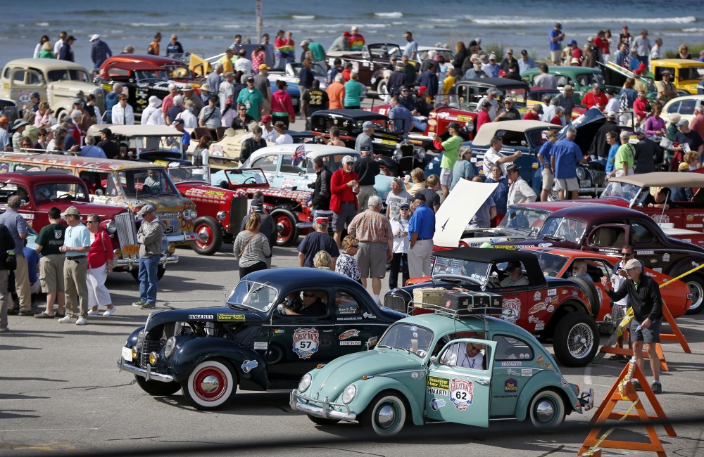 Hundreds of spectators crowd a parking lot at Ogunquit Beach to view participating cars before the start of the Great Race road rally on Saturday in Ogunquit.