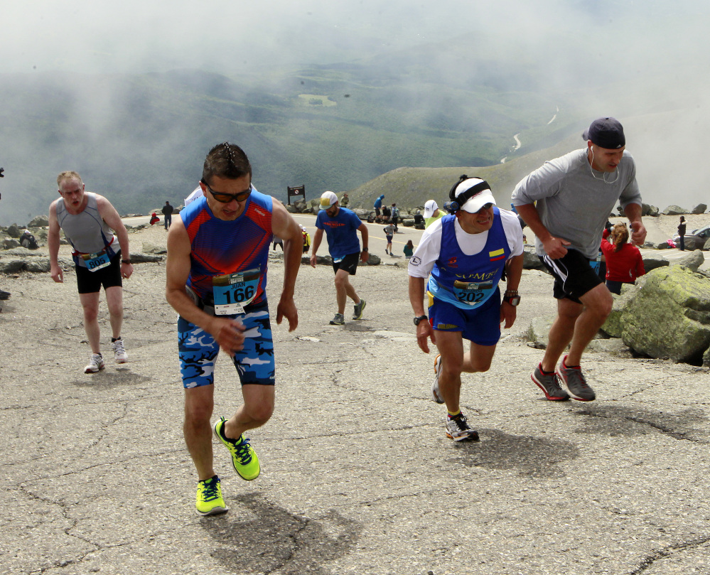 Runners struggle to make it to the top up the Mount Washington Auto Road during the  Northeast Delta Dental Mt. Washington Road Race, on Saturday. More than 1,000 runners raced 7.6 miles to the highest peak in the Northeast of 6,288 feet