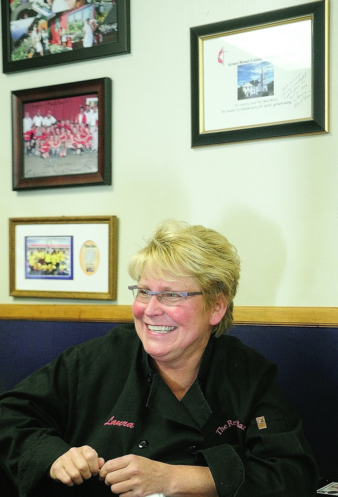 Advocare: Sitting beside several framed thank-you notes from fundraisers, owner Laura Benedict talks to a reporter at The Red Barn in November. Benedict was recently named Best Business Advocate in Down East magazine’s 2014 Best Of poll.
