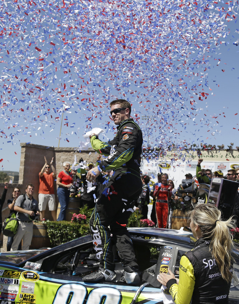 AP photo
Carl Edwards stands atop his car after winning the NASCAR Sprint Cup Series race on Sunday in Sonoma, Calif. Jeff Gordon finished in second place.