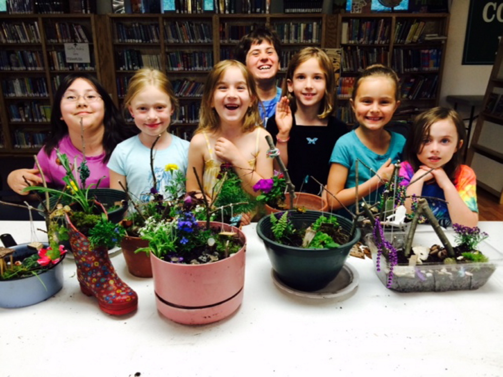 Students with their fairy container gardens, from left, are  Isavel LuxSoc, Ella Saphia Moore, Addison Turner, Emily Nichols, Kate Nichols, Emily Kynn Carlson and Lilian Rispoli. The Nichols girls are from Winslow, the other children live in Palermo.
