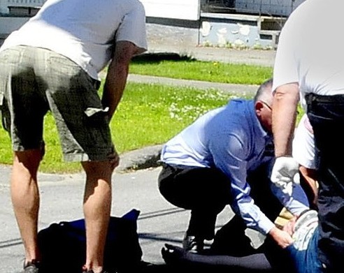 A male motorcycle operator is treated at the scene and later transported to the hospital following a collision with a vehicle at the intersection of Pleasant Street and Western Avenue in Waterville on Monday, June 23, 2014.