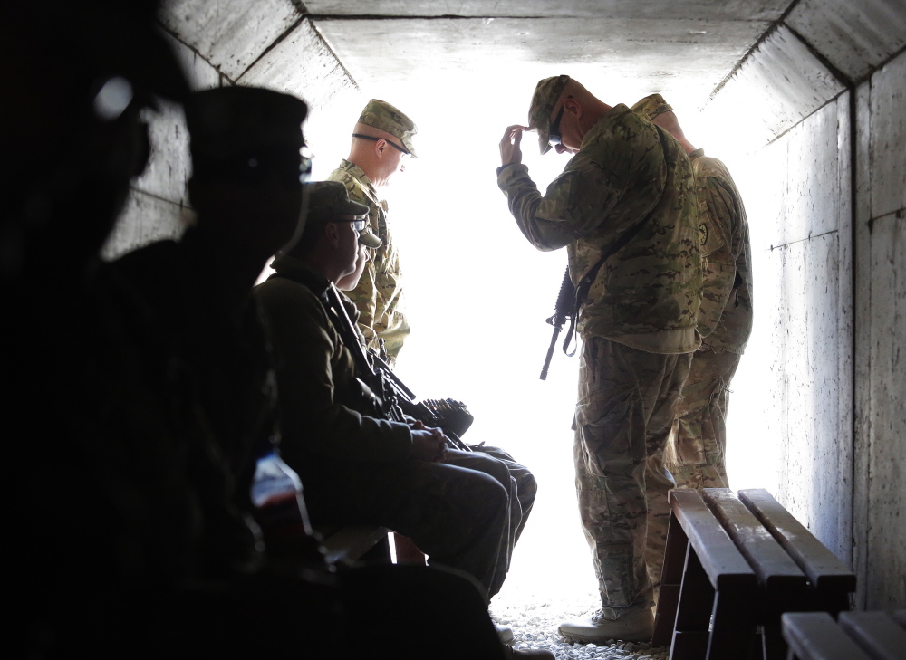 Soldiers from the 133rd Engineer Battalion of the Gardiner-based Maine Army National Guard wait in a bunker for the all clear signal after Bagram Airfield was put on alert in December. Officials have confirmed the battalion has returned to the U.S. and is at Fort Dix, N.J.