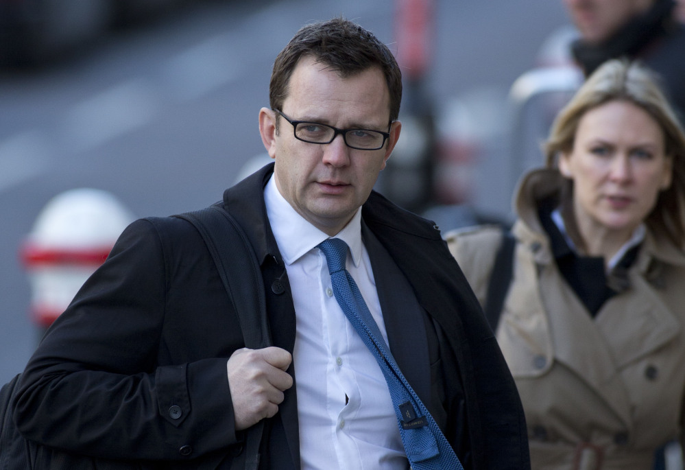 This is a  Friday, Feb.  21, 2014 file photo of Andy Coulson, former News of the World editor and former aide to British Prime Minister David Cameron arrives at the Central Criminal Court in London.