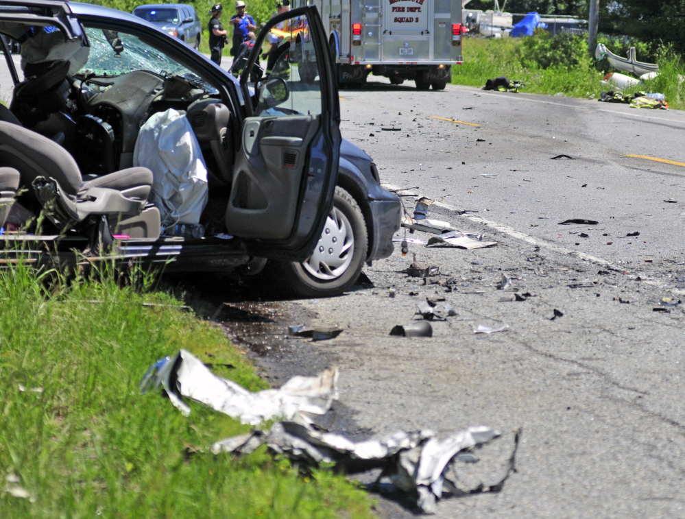 This van on one side of U.S. Route 202, left, and a white car on the other side, top right, were involved in a head-on collision on Friday near TJ’s Place in Monmouth.