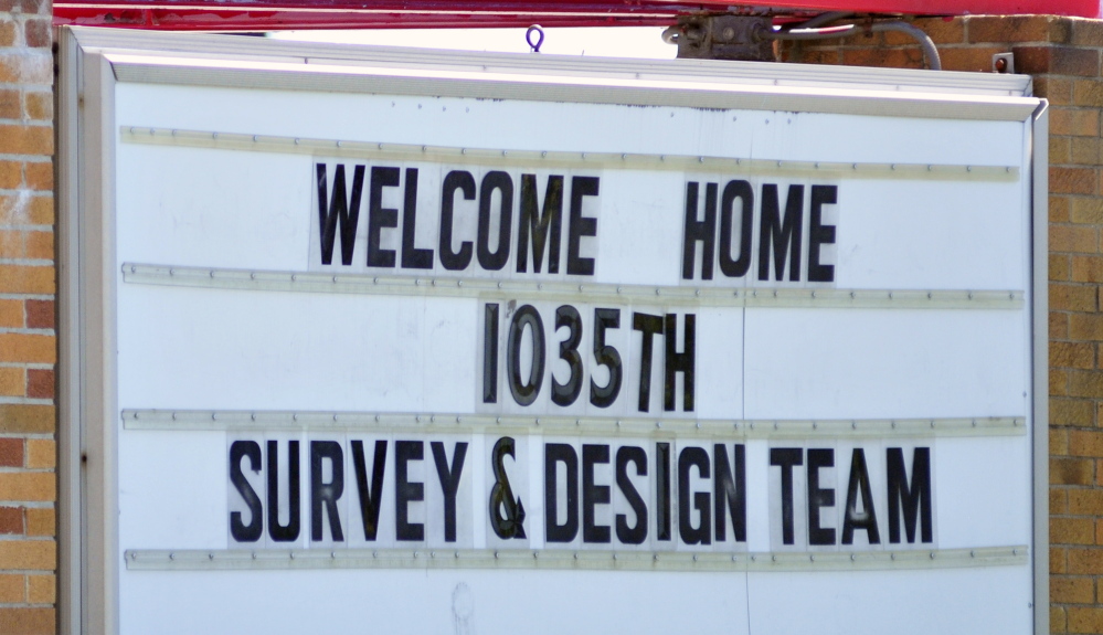 A sign in front of the Augusta Armory welcomes the soldiers home on Friday.