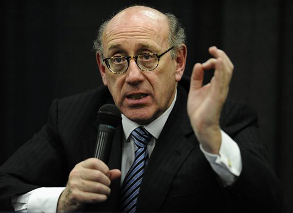 In this July 2013 photo, attorney and special adviser Kenneth Feinberg speaks at a public forum on the distribution of Newtown donations at Edmond Town Hall in Newtown, Conn. Feinberg plans to announce the terms of General Motors’ plan to pay victims of crashes caused by bad ignition switches on Monday.