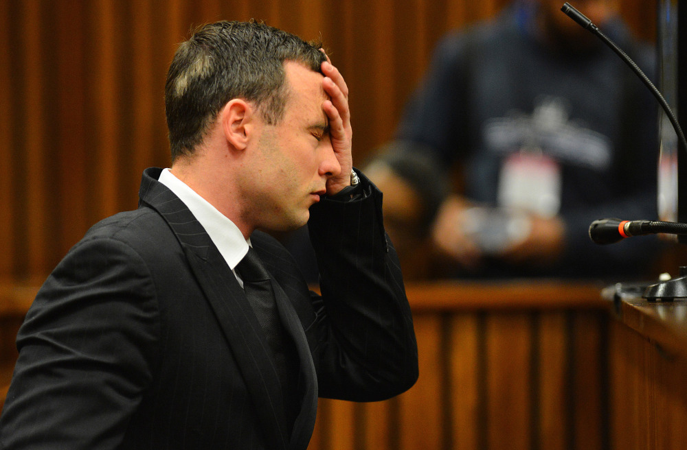 Oscar Pistorius listens to evidence in court in Pretoria, South Africa. The murder trial of Pistorius resumed Monday,after one month during which mental health experts evaluated the athlete to determine if he has an anxiety disorder that could have influenced his actions on the night he killed girlfriend Reeva Steenkamp.