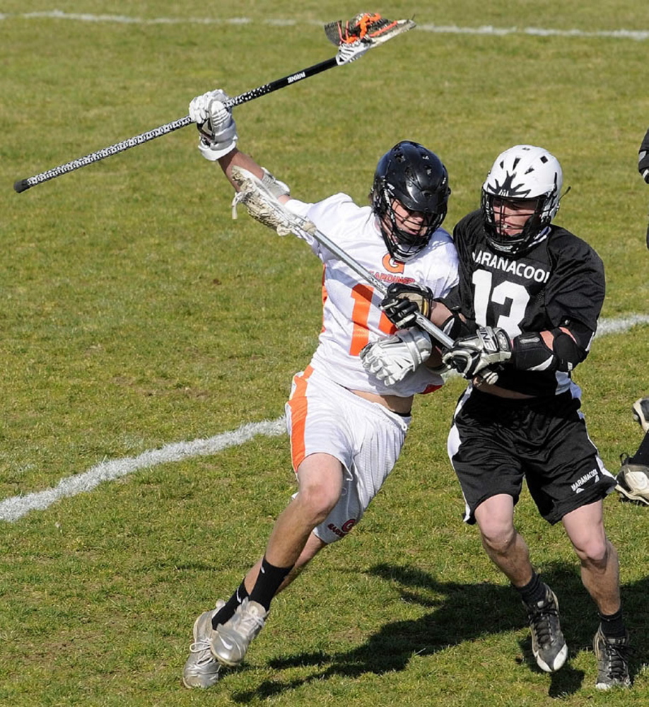 Staff file photo by Joe Phelan 
 Gardiner's Jake Truman, left, tries to get past  Maranacook/Winthrop's Gabe Giguere during game at Hoch Field.