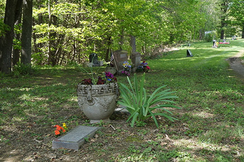 Maureen Milliken Photo SAD ROW: The graves of Bobby Dee Lane, who died at the age of 1, and Jeffrey Scott Lane, who died when he was 4, are in the foreground of a sad row at North Fairfield Friends Cemetery. To the left center is Nathan P. Morin’s grave and the red bench at Avery Lane’s grave can be seen in the back. Avery died in 2012 at age 6.