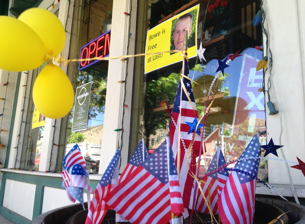 The Associated Press/Brian Skoloff Flags and balloons marking the release from captivity of Sgt. Bowe Bergdahl adorn the sidewalk outside a shop in the soldier’s hometown of Hailey, Idaho, Wednesday, June 4, 2014.  The exchange for five Taliban detainees from Guantanamo and the still-murky circumstances of how Bergdahl came to be captured nearly five years ago have prompted a fierce debate in Washington and across the country.