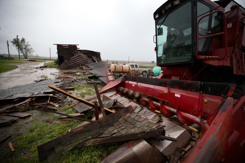 The Associated Press A destroyed barn is seen in Oakland, Iowa, on Tuesday. Severe weather packing large hail and heavy rain rolled into Nebraska and Iowa on Tuesday as potentially dangerous storms targeted a swath of the Midwest, including states where voters were casting ballots in primary elections.