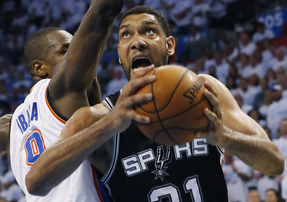 AP photo DON’T REMIND ME: San Antonio Spurs forward Tim Duncan (21) remembers last year’s NBA Finals. Though the Spurs outscored the Miami Heat in the series, it was the Heat that took home the NBA title.