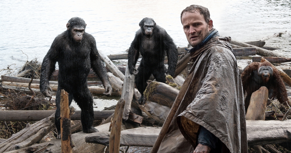 EMBARGOED FROM ONLINE FOR 3:01 AM EDT   Malcolm (Jason Clarke) is followed by Caesar (Andy Serkis), Koba (Toby Kebbell) and Maurice (Karin Konoval) as he tries to make peace with them in a scene from the motion picture "Dawn of the Planet of the Apes."  CREDIT: WETA/20th Century Fox  [Via MerlinFTP Drop]