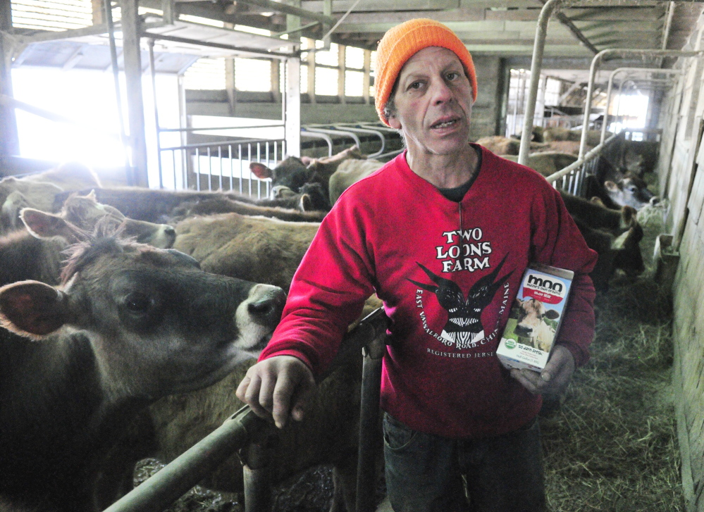 Spencer Aitel, at Two Loons Farm in March, said a lack of a deal for farmers who once dealt their milk through Maine’s Own Organic is causing tension among the farmers involved.