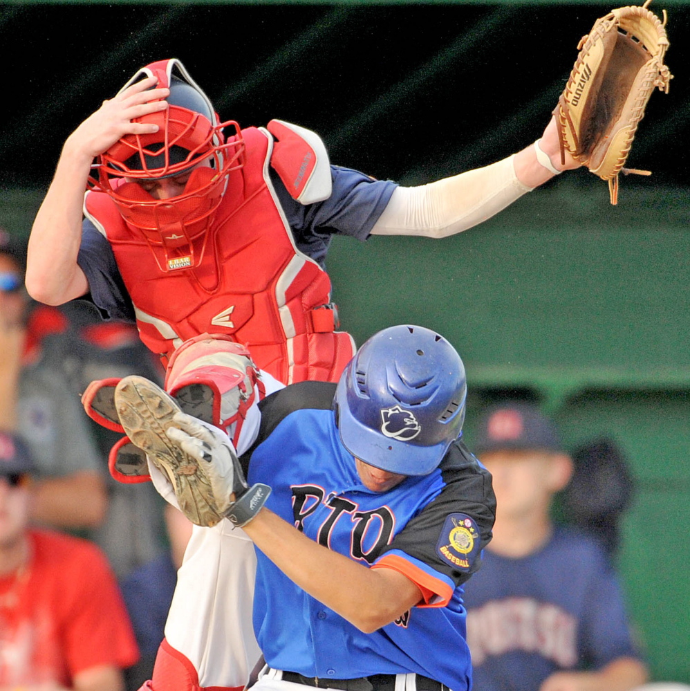Post 51 catcher Josh Woodard (3) jumps for the ball as RTD of Madison’s Chase Nelson collides with him at home plate Tuesday at Colby College in Waterville. RTD defeated Post 51 5-2.