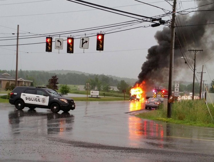 The cab of a tractor-trailer burns near the intersection of Route 3 and Church Hill Road in Augusta Wednesday night.