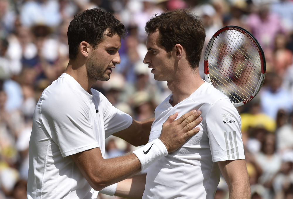 Grigor Dimitrov, left, is congratulated by defending champion Andy Murray of Britain after winning their men’s singles quarterfinal match Wednesday at the All England Lawn Tennis Championships in Wimbledon, London.