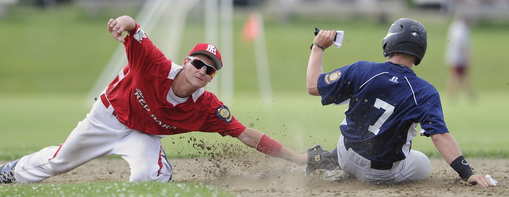 Gardiner’s Kyle Fletcher slides safely Thursday beyond the tag of Red Barn’s Tyler Bailey into second base during an American Legion baseball match-up in Monmouth.