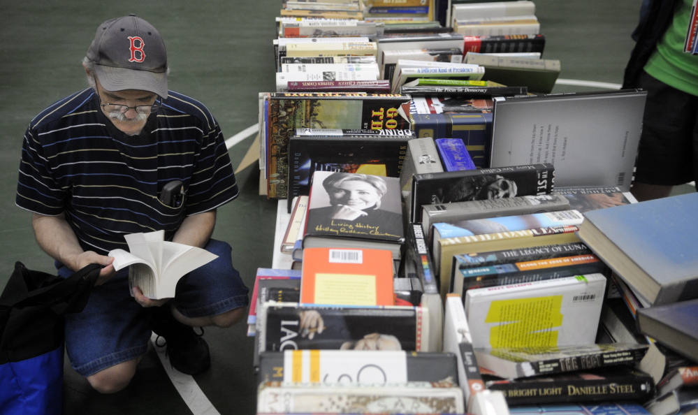Visitors at the Center For All Seasons in Belgrade browse books for sale. While some of the town’s Fourth of July events were postponed because of rain, the Belgrade Public Library’s annual book sale went off without a hitch, though it was moved into the center from outdoors in the village.