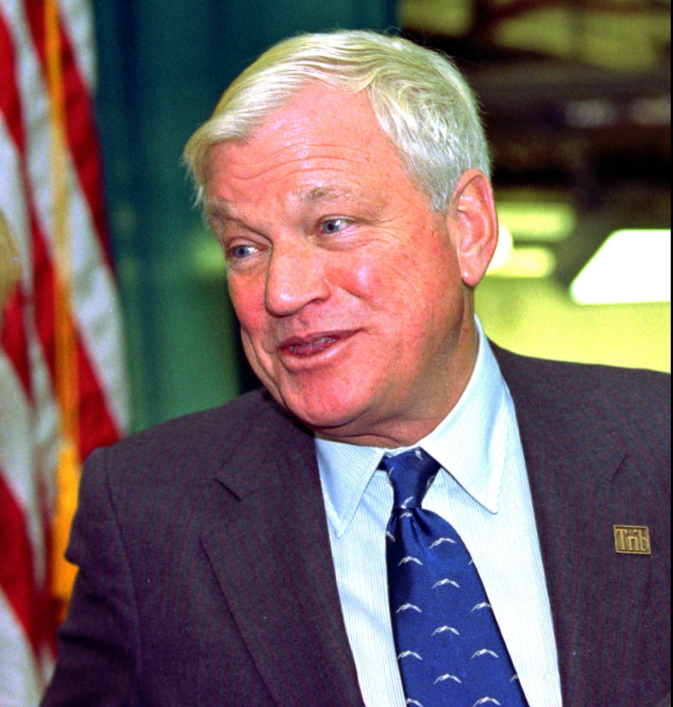In this Oct. 23, 1997, file photo, billionaire Richard Mellon Scaife, owner and publisher of the Tribune Review newspapers in Pittsburgh and Greensburg, Pa., greets visitors as they enter the paper’s new facility in Warrendale, Pa. during the dedication of the building. Scaife, who published the Pittsburgh Tribune-Review and funded libertarian and conservative political causes, including a one-time effort to discredit President Bill Clinton, died at his home early Friday, July 4, 2014, one day after his birthday, He was 82. In 2013, Forbes estimated his wealth at $1.4 billion.