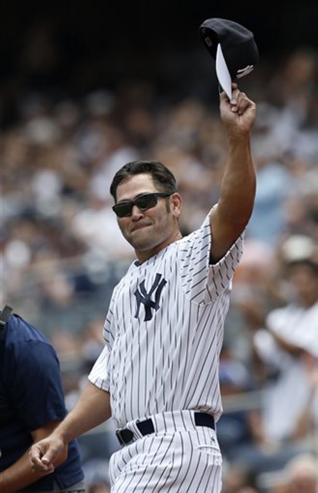 Former New York Yankees outfielder Johnny Damon tips his cap during introductions for the 68th annual Old Timers Day on June 22 at Yankee Stadium in New York. Damon, 40, still believes he can play Major League Baseball.