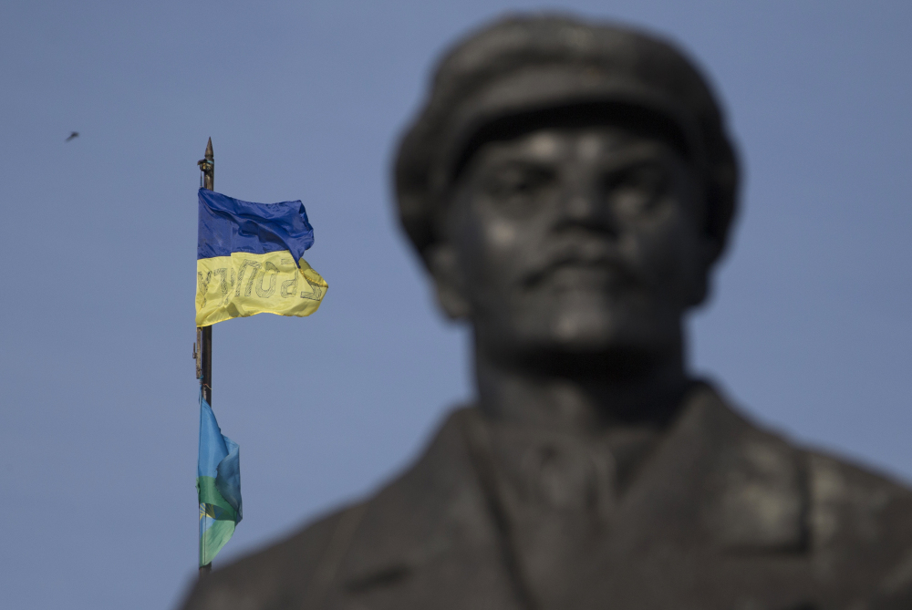 A Ukrainian flag is seen over a government building in the city of Slovyansk, Donetsk Region, eastern Ukraine on Saturday with a statue of Soviet Union founder Vladimir Lenin on the left. Ukraine’s forces claimed a significant success against pro-Russian insurgents on Saturday, chasing them from one of their strongholds in the embattled east of the country. Rebels fleeing from the city of Slovyansk vowed to regroup elsewhere and fight on.