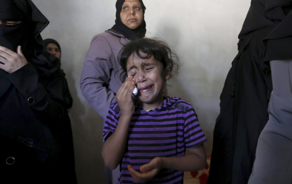 Asma weeps at the funeral of her brother, Gomha Abu Shalouf, 27, a member of the Ezz Al-Din Al Qassam Brigades, the military wing of Hamas, who was killed in an airstrike in Rafah, southern Gaza Strip on Monday as violence in the region escalates.