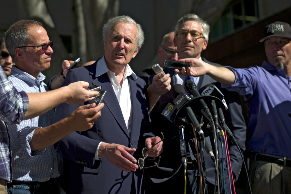 Bert Fields, center left, an attorney for Shelly Sterling, the wife of Los Angeles Clippers owner Donald Sterling, talks to reporters as he is joined by Adam Streisand, an attorney for former Microsoft CEO Steve Ballmer, outside the Los Angeles Superior Court on Tuesday.