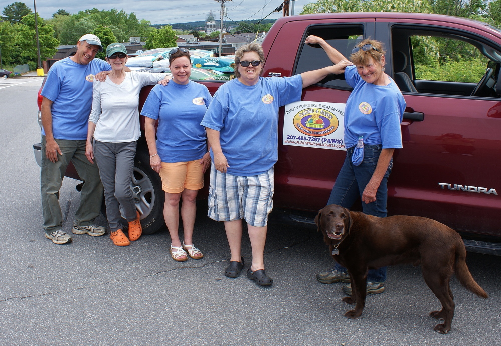 Cause 4 Paws in Hallowell recently held a pet food drive to benefit the Amy Buxton Pet Pantry. From left, picking up donated pet food from Pet Life and the Shaw’s Plaza in Augusta, are Marc Poirier, Mary Pillsbury, Dee DeHaas, Cause 4 Pause Laurel Rouillard, Myra Macfie and dog Buster.